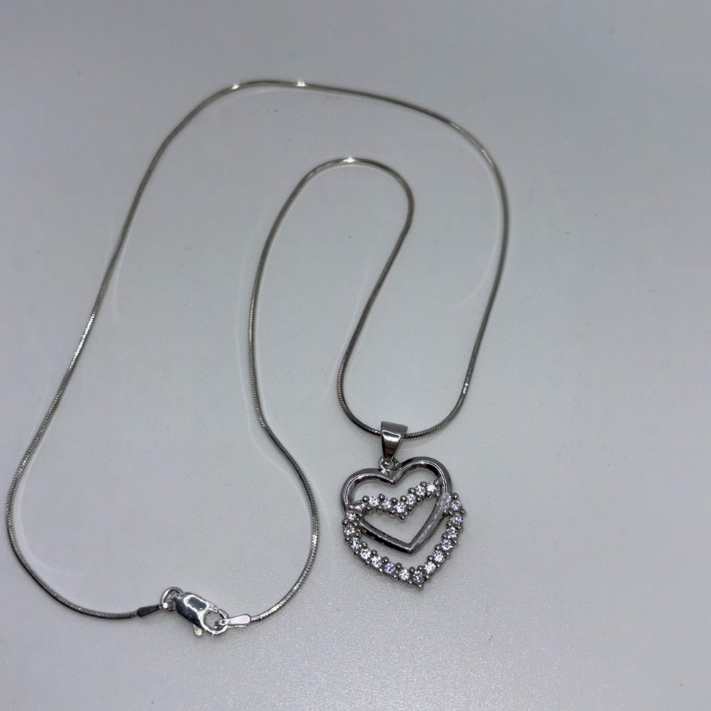 925 Sterling silver chain and double heart pendent with CZ accents.